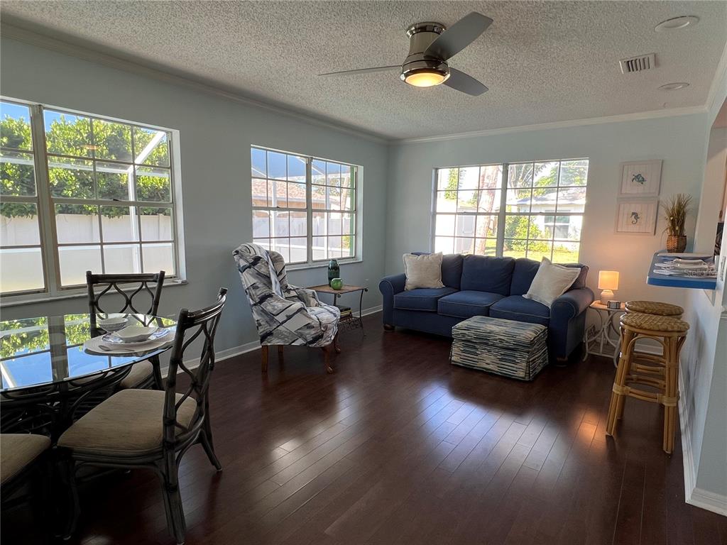 1536 Porpoise Road Venice, FL 34293 - Photo 13 of 32 a living room with furniture wooden floor and a window