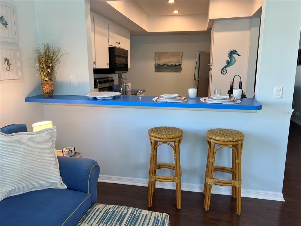 1536 Porpoise Road Venice, FL 34293 - Photo 16 of 33 a view of dining room with furniture and wooden floor
