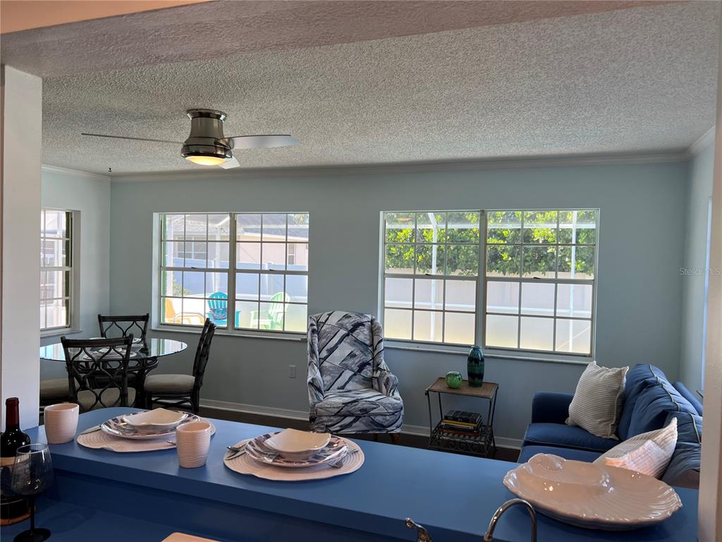 1536 Porpoise Road Venice, FL 34293 - Photo 17 of 32 a living room with furniture and a large window