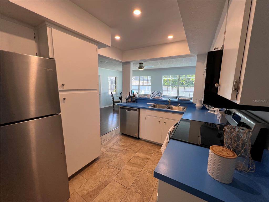 1536 Porpoise Road Venice, FL 34293 - Photo 19 of 32 a kitchen with stainless steel appliances a refrigerator and a sink