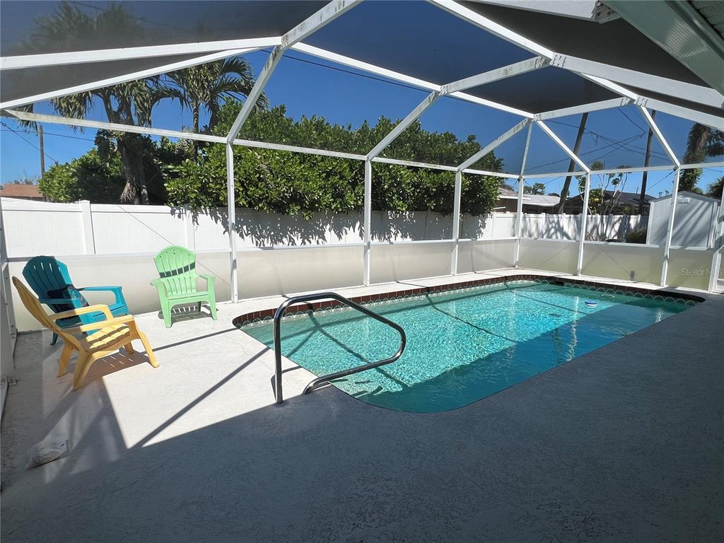 1536 Porpoise Road Venice, FL 34293 - Photo 2 of 32 a view of an chairs and tables in the patio