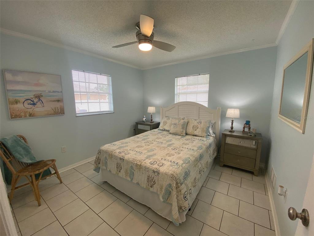 1536 Porpoise Road Venice, FL 34293 - Photo 24 of 32 a bedroom with a bed and a window
