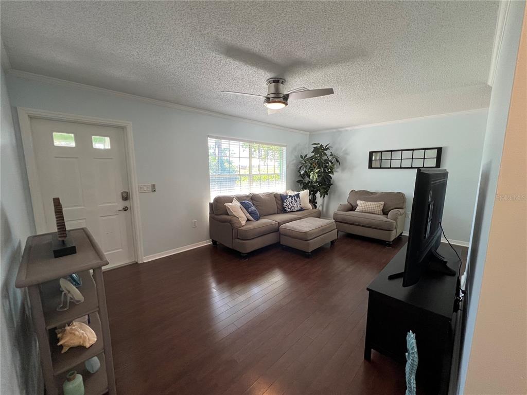 1536 Porpoise Road Venice, FL 34293 - Photo 8 of 32 a living room with furniture and a window