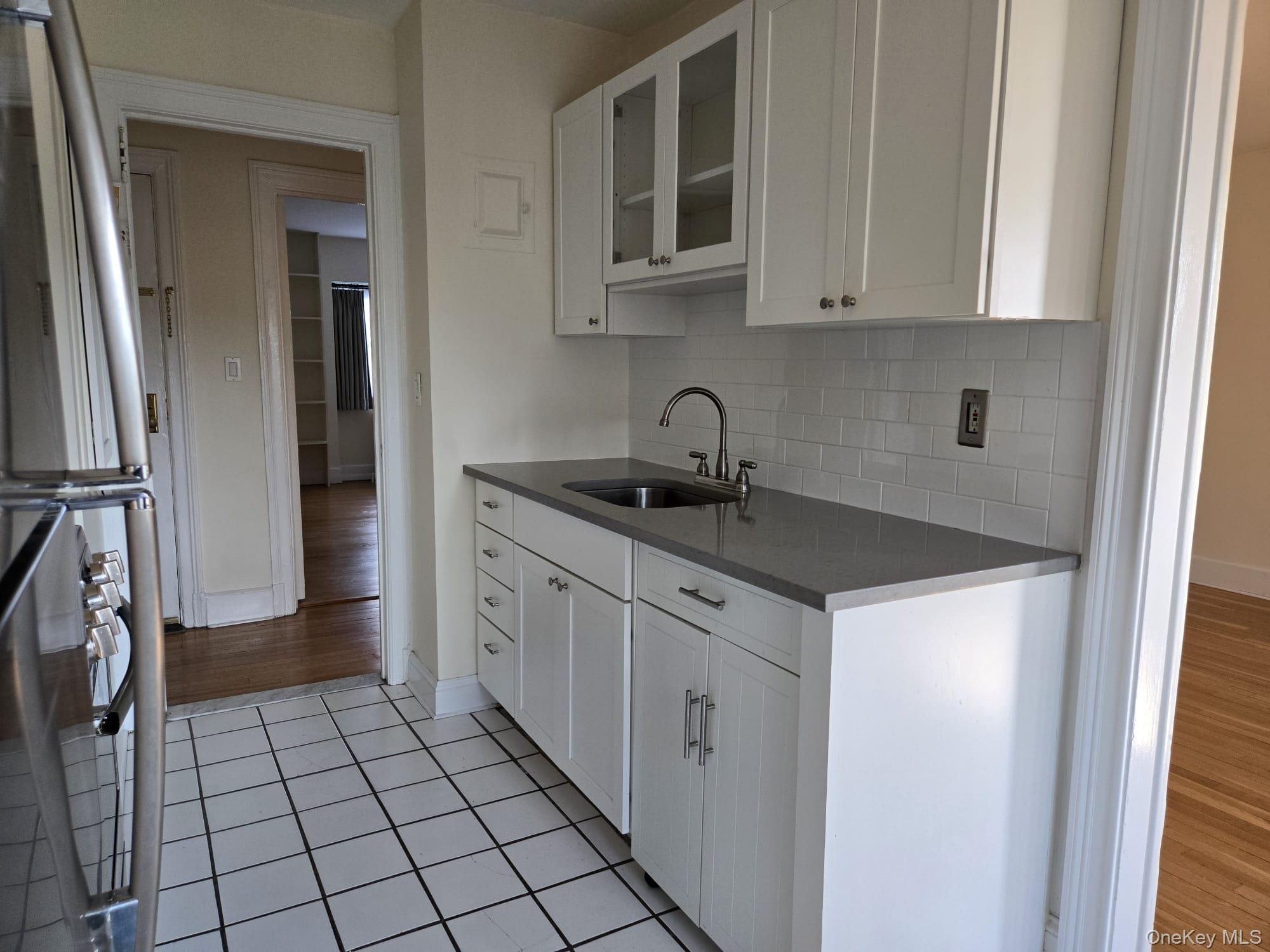 6 Davis Avenue, Unit A11 Rye, NY 10580 - Photo 12 of 23 Kitchen with recent cabinetry.