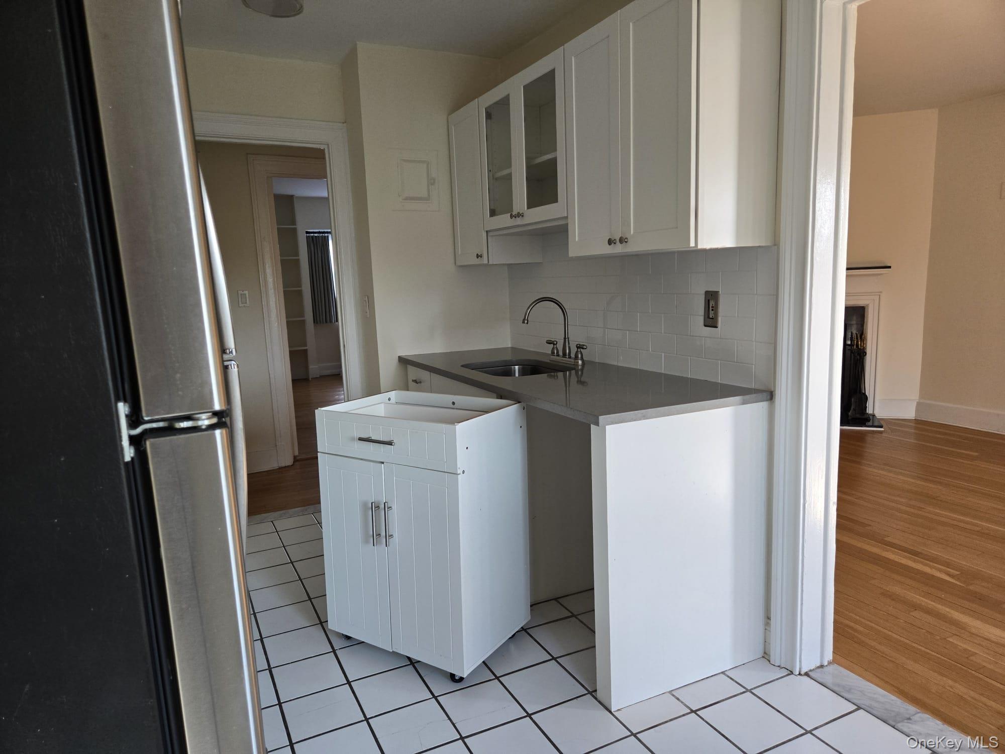 6 Davis Avenue, Unit A11 Rye, NY 10580 - Photo 13 of 23 Behind this cabinet is the dish-washer hook up if new owner wishes to add one.