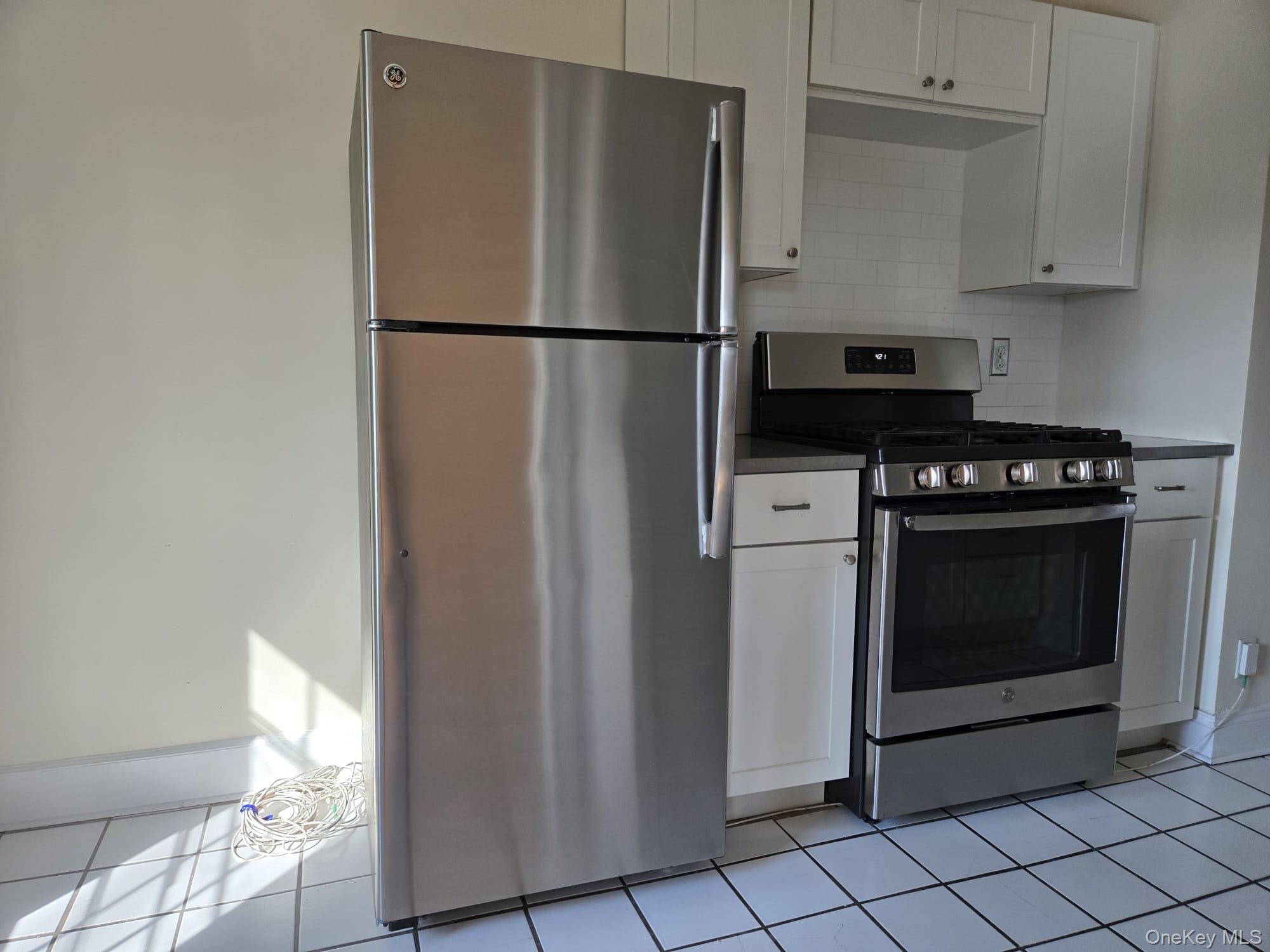 6 Davis Avenue, Unit A11 Rye, NY 10580 - Photo 10 of 23 Kitchen with Stainless Steel appliances.