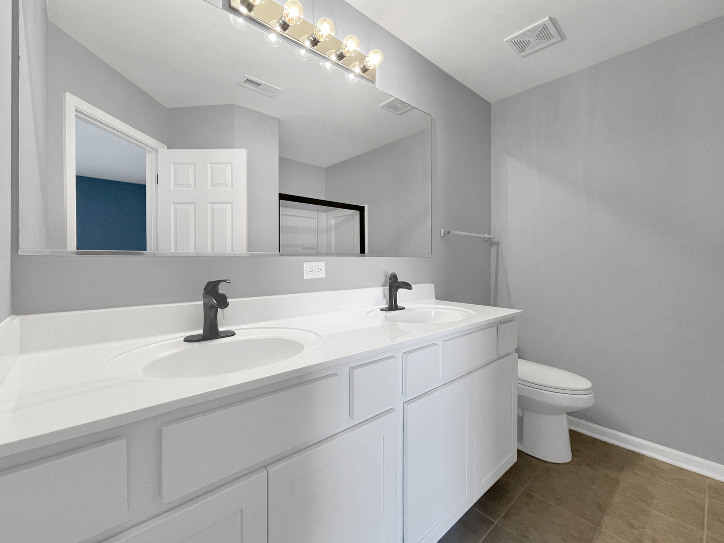 3414 Cameron Drive Elgin, IL 60124 - Photo 15 of 24 a bathroom with a sink a toilet and mirror