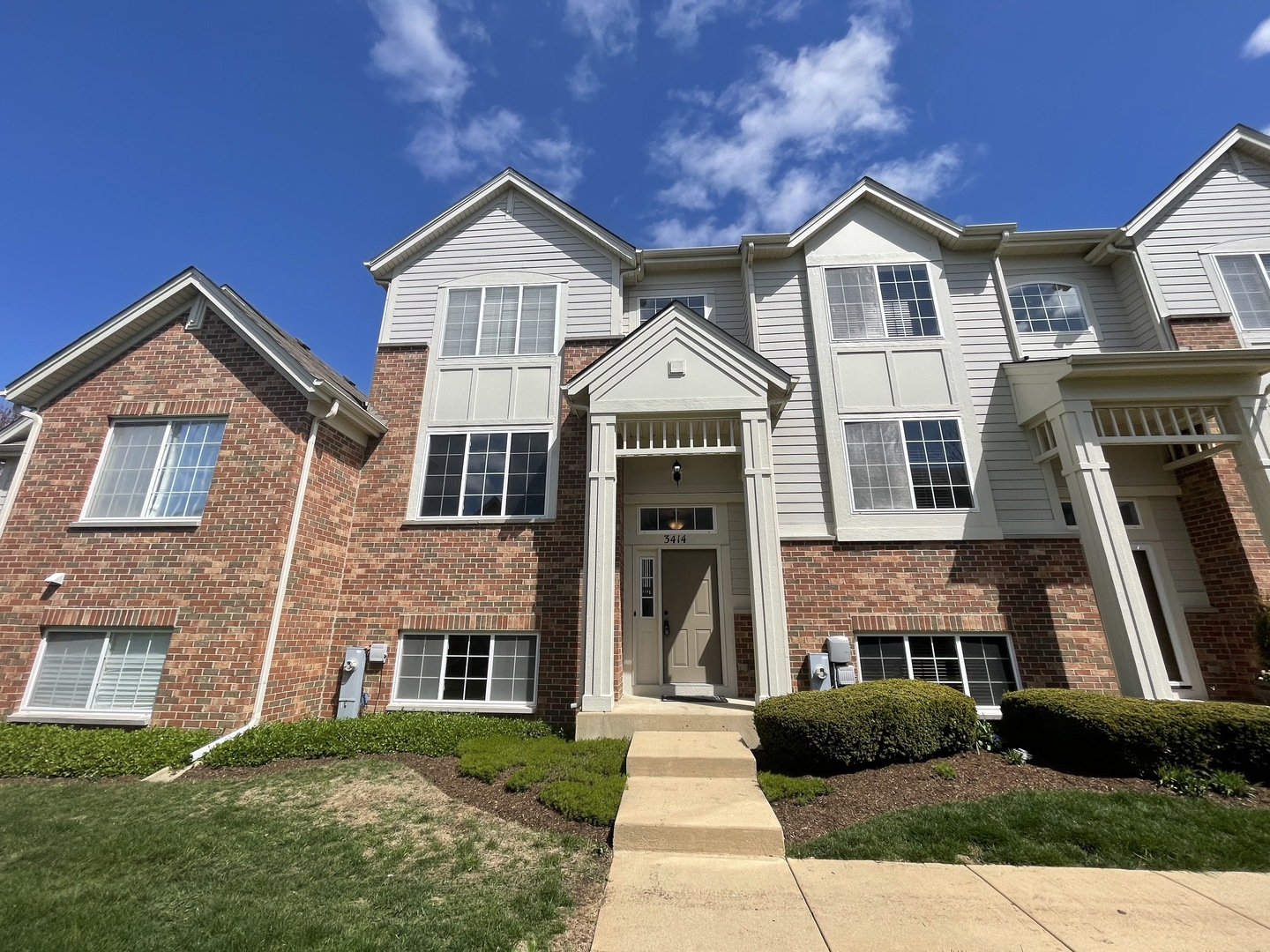 3414 Cameron Drive Elgin, IL 60124 - Photo 2 of 24 a front view of a house with a yard