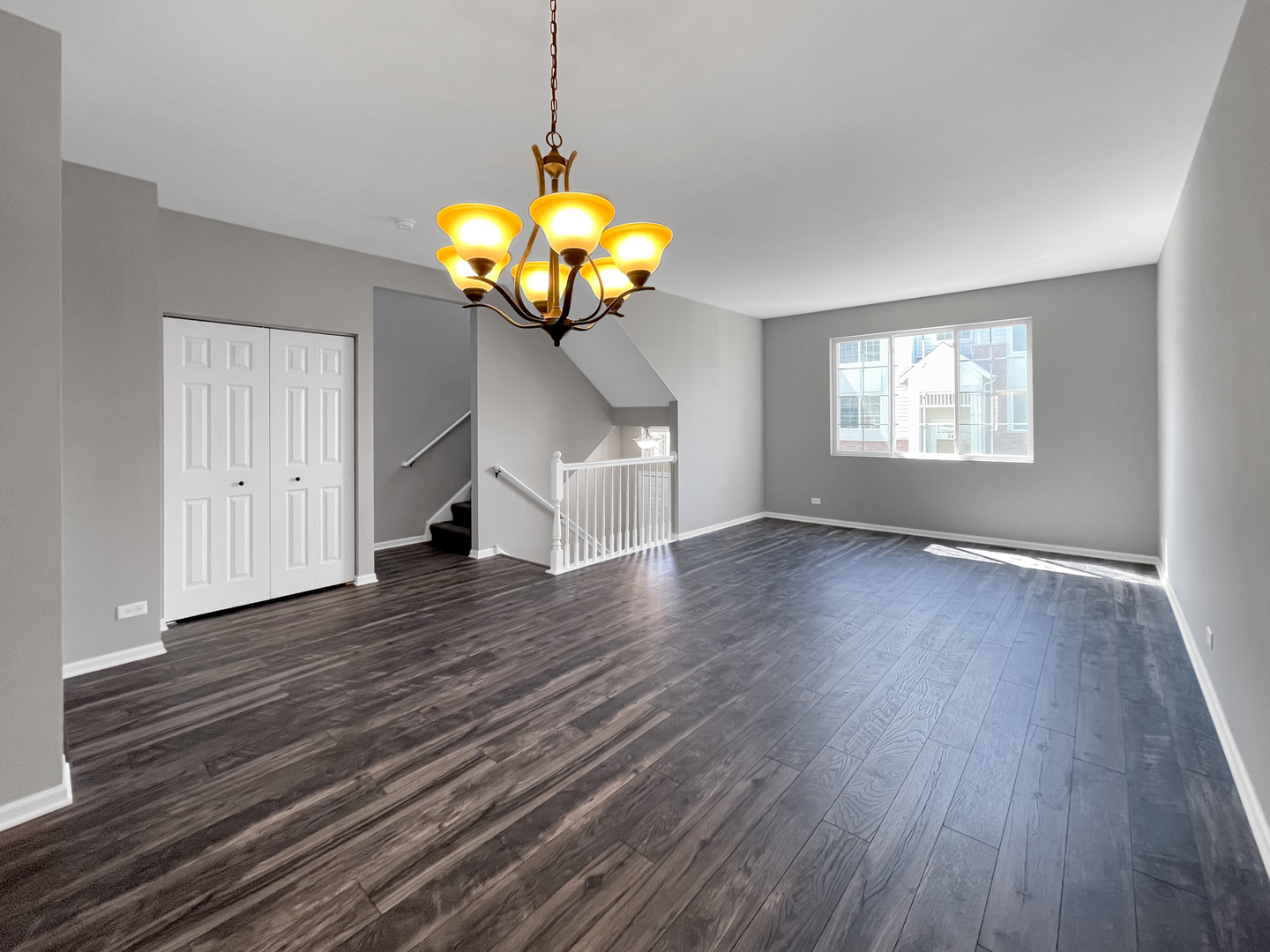 3414 Cameron Drive Elgin, IL 60124 - Photo 3 of 24 a view of a room with wooden floor chandelier and a ceiling fan