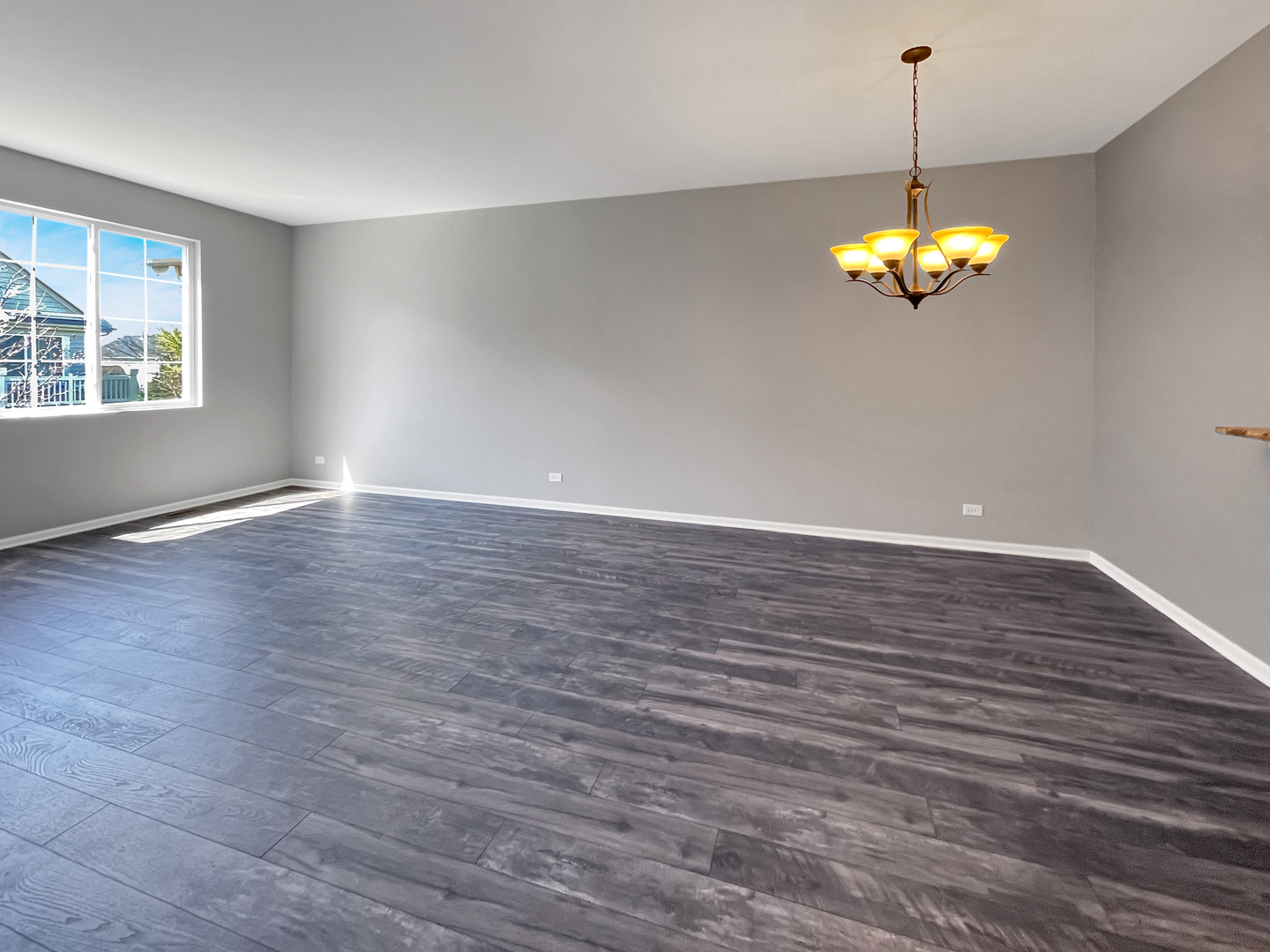 3414 Cameron Drive Elgin, IL 60124 - Photo 5 of 24 wooden floor in an empty room with a window