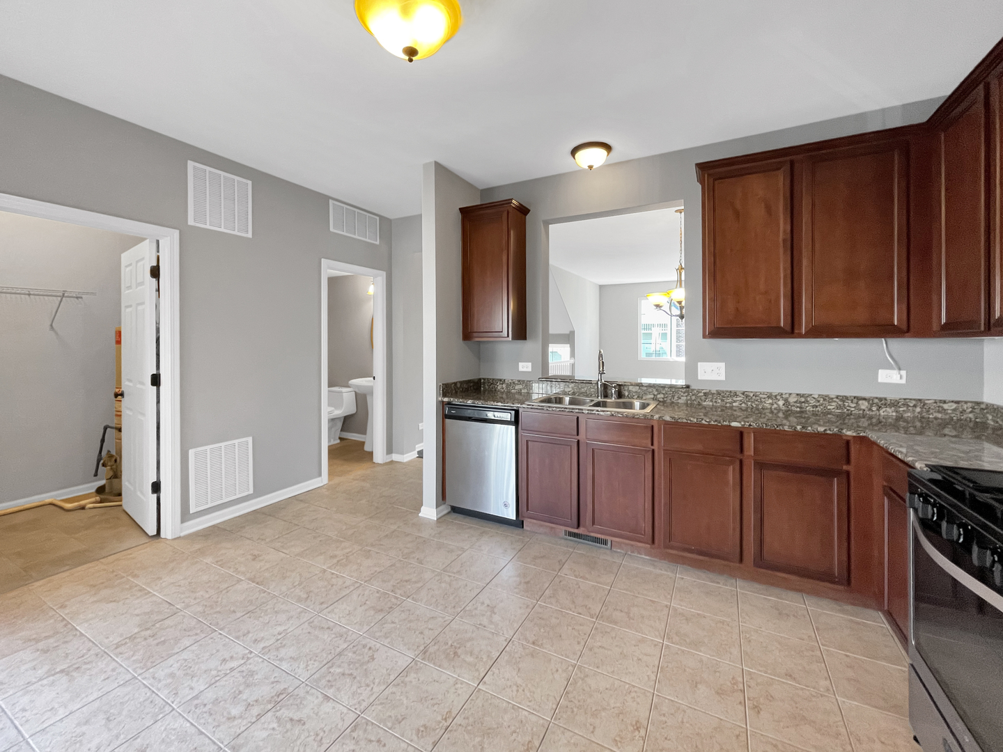 3414 Cameron Drive Elgin, IL 60124 - Photo 8 of 24 a large kitchen with a stove a sink and a refrigerator