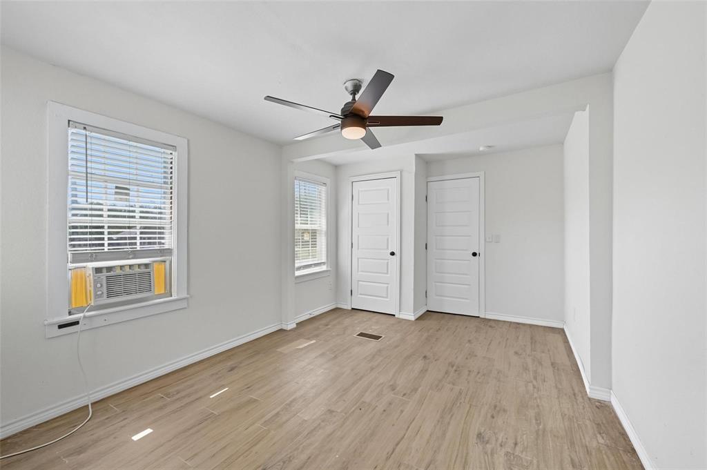 622 South Charles Street, Unit 622 Sherman, TX 75090 - Photo 10 of 21 a view of empty room with wooden floor and fan