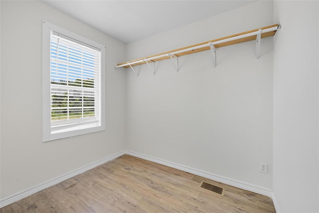 622 South Charles Street, Unit 622 Sherman, TX 75090 - Photo 12 of 21 a view of a room with wooden floor and fan