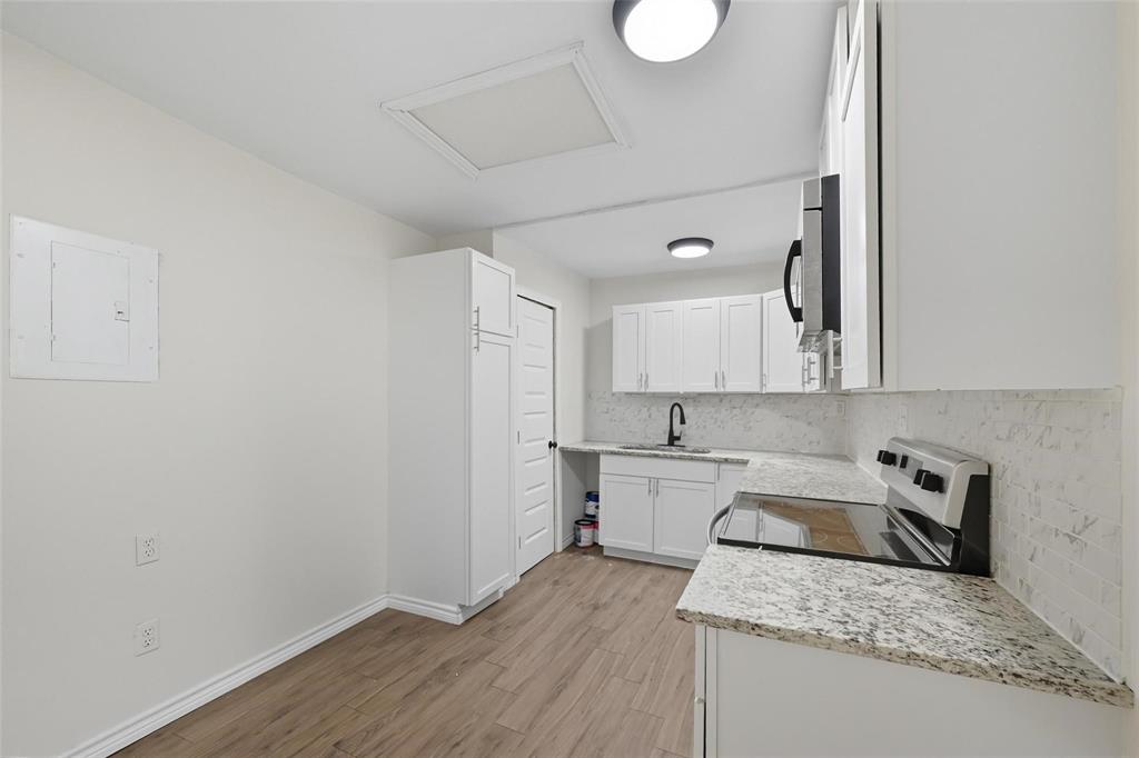 622 South Charles Street, Unit 622 Sherman, TX 75090 - Photo 2 of 21 a kitchen with a sink cabinets and wooden floor