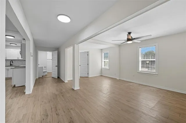 a view of a kitchen with wooden floor