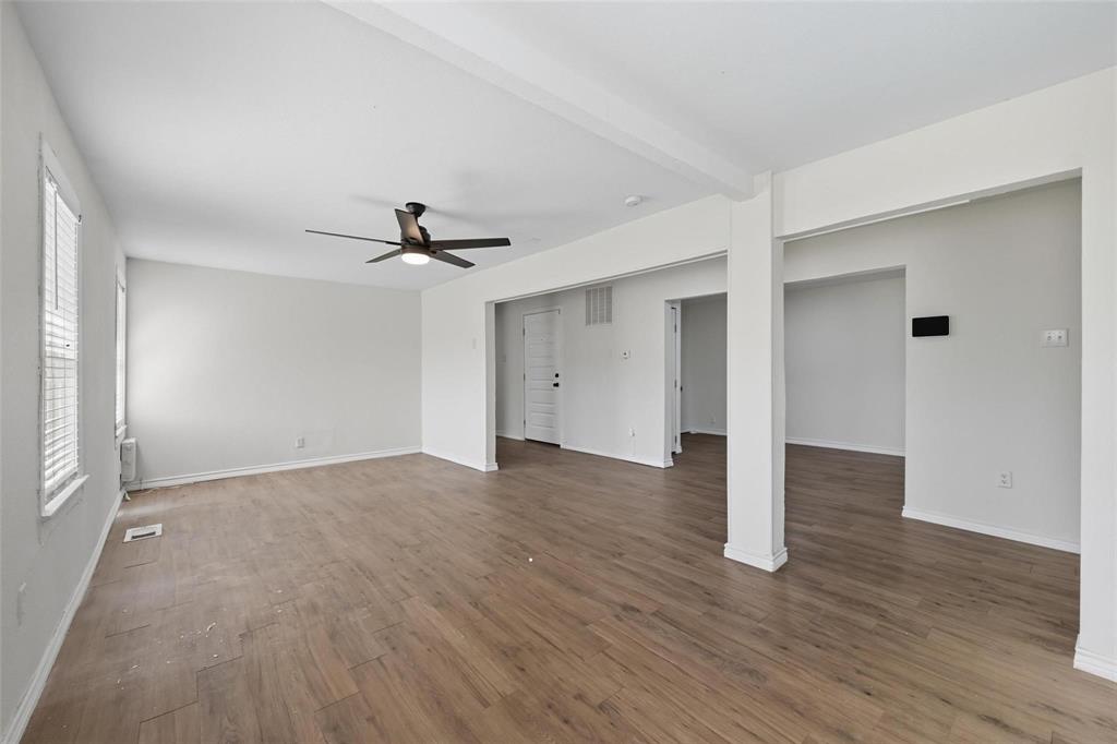 622 South Charles Street, Unit 622 Sherman, TX 75090 - Photo 4 of 21 a view of empty room with wooden floor and ceiling fan