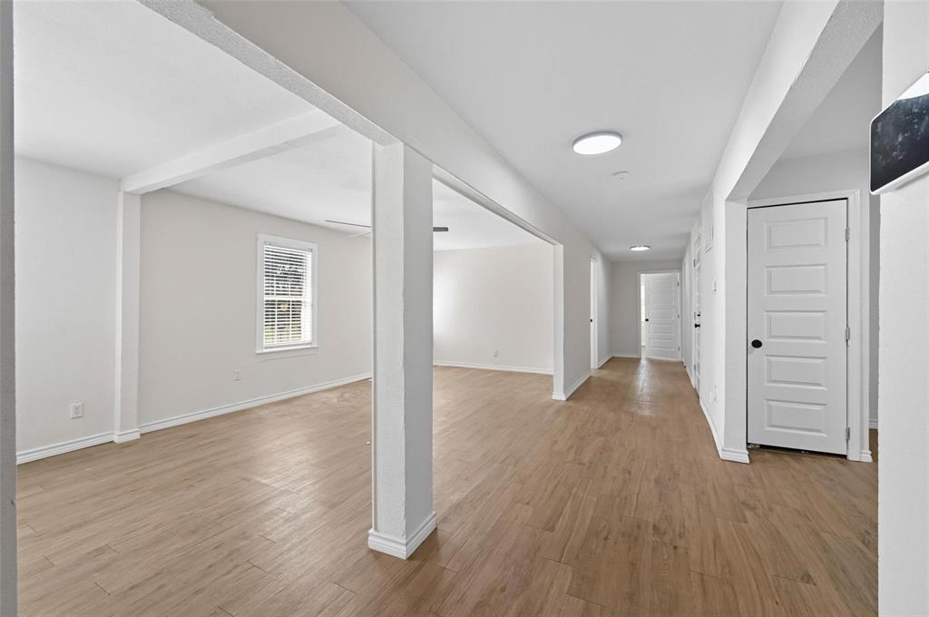 622 South Charles Street, Unit 622 Sherman, TX 75090 - Photo 5 of 21 wooden floor in an empty room with a window