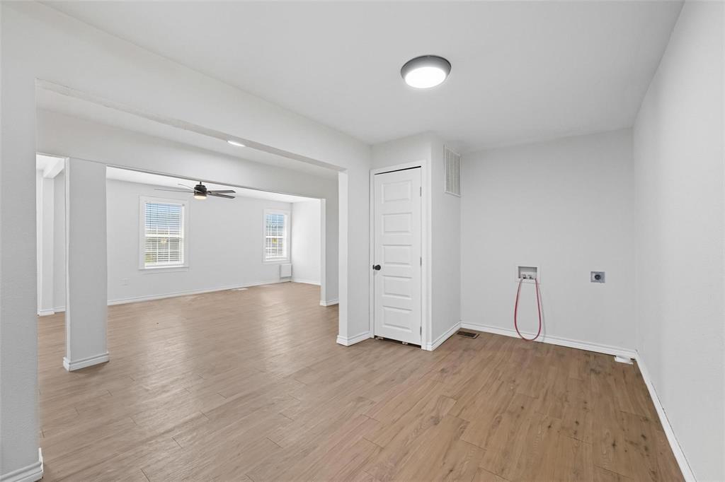 622 South Charles Street, Unit 622 Sherman, TX 75090 - Photo 6 of 21 a view of empty room with wooden floor and fan