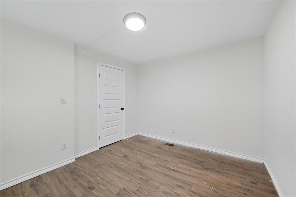 622 South Charles Street, Unit 622 Sherman, TX 75090 - Photo 9 of 21 a view of a room with wooden floor and white walls