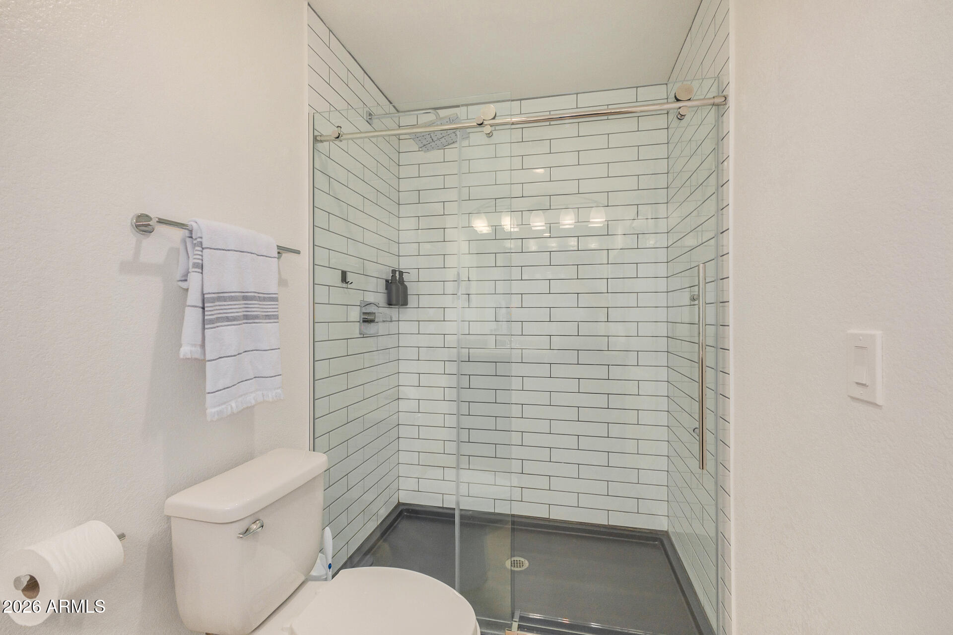 2725 East Mine Creek Road, Unit 1101 Phoenix, AZ 85024 - Photo 21 of 43 a bathroom with a toilet and shower