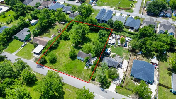 an aerial view of a house with a garden