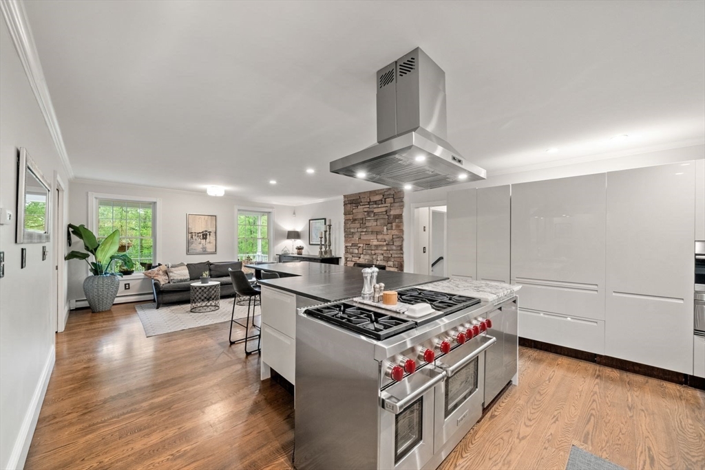176 Spring Street Hopkinton, MA 01748 - Photo 11 of 42 a kitchen with stove and a refrigerator