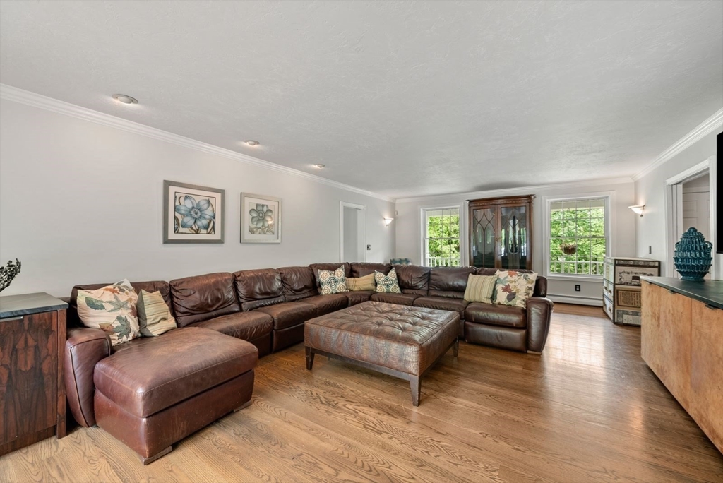 176 Spring Street Hopkinton, MA 01748 - Photo 18 of 42 a living room with furniture and a large window