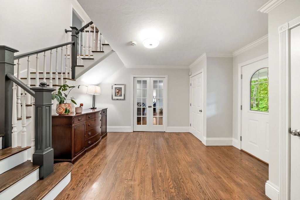 176 Spring Street Hopkinton, MA 01748 - Photo 24 of 42 a view of entryway and hall with wooden floor