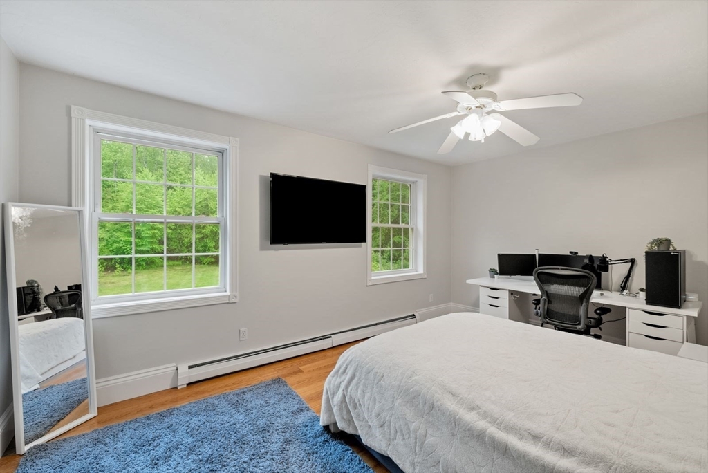 176 Spring Street Hopkinton, MA 01748 - Photo 25 of 42 a bedroom with a large bed and a window