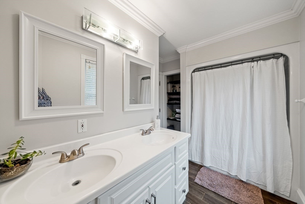 176 Spring Street Hopkinton, MA 01748 - Photo 26 of 42 a bathroom with a sink vanity and a mirror