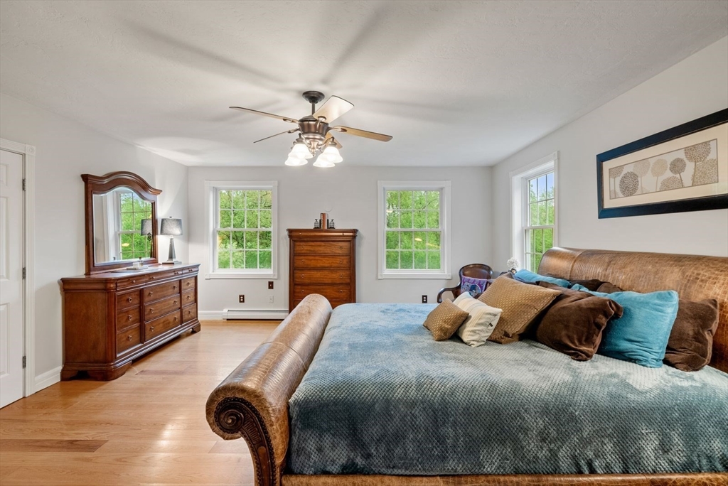 176 Spring Street Hopkinton, MA 01748 - Photo 28 of 42 a bedroom with a bed dresser and a window