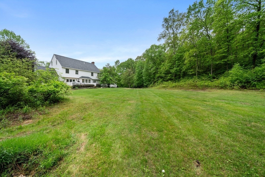 176 Spring Street Hopkinton, MA 01748 - Photo 37 of 42 a view of a big yard with large trees