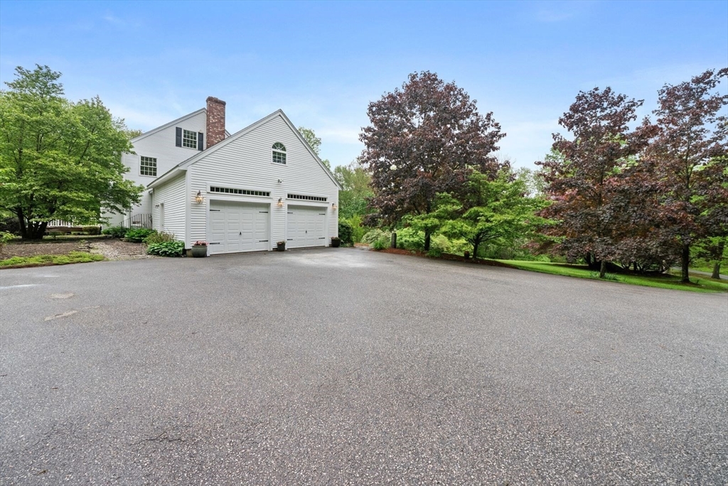 176 Spring Street Hopkinton, MA 01748 - Photo 38 of 42 a view of a house with a street