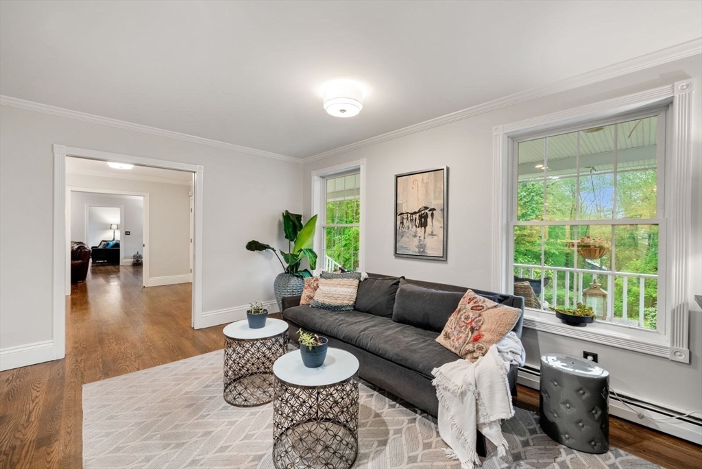 176 Spring Street Hopkinton, MA 01748 - Photo 8 of 42 a living room with furniture and a wooden floor