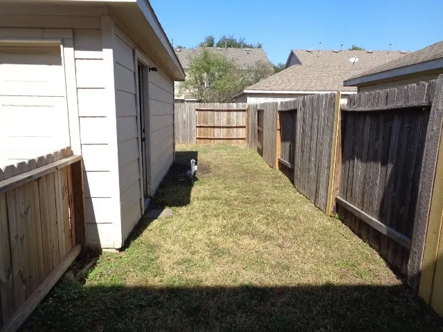a view of a backyard of the house