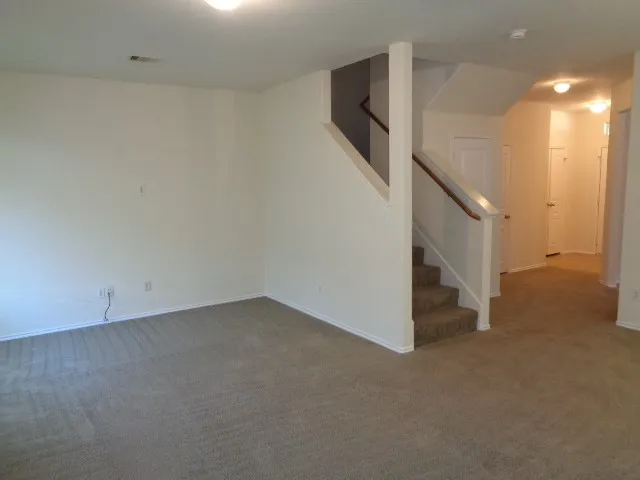 a view of a livingroom with an empty room