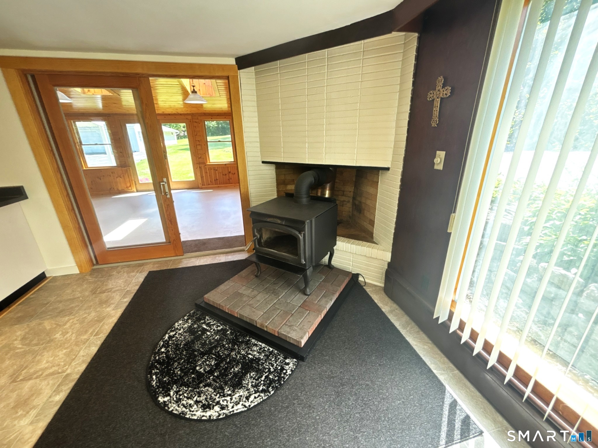 44 Summit Road Prospect, CT 06712 - Photo 14 of 40 a living room with a table and a large window