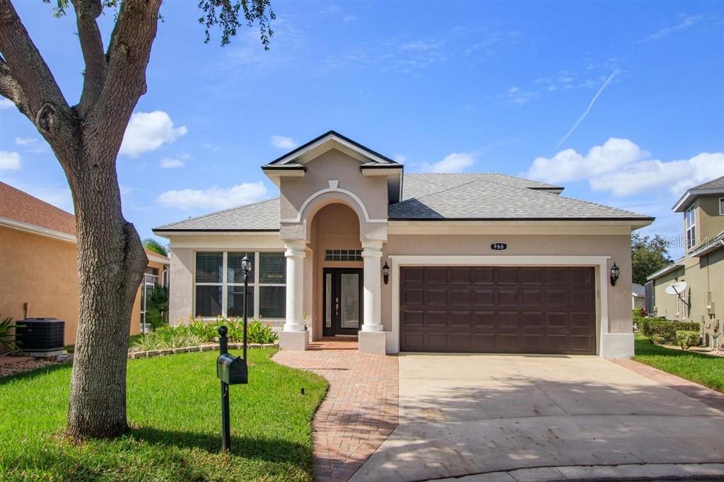 966 Ridgemount Place Lake Mary, FL 32746 - Photo 1 of 1 a front view of a house with a yard and garage