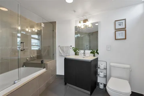 a view of a hallway with washer and dryer