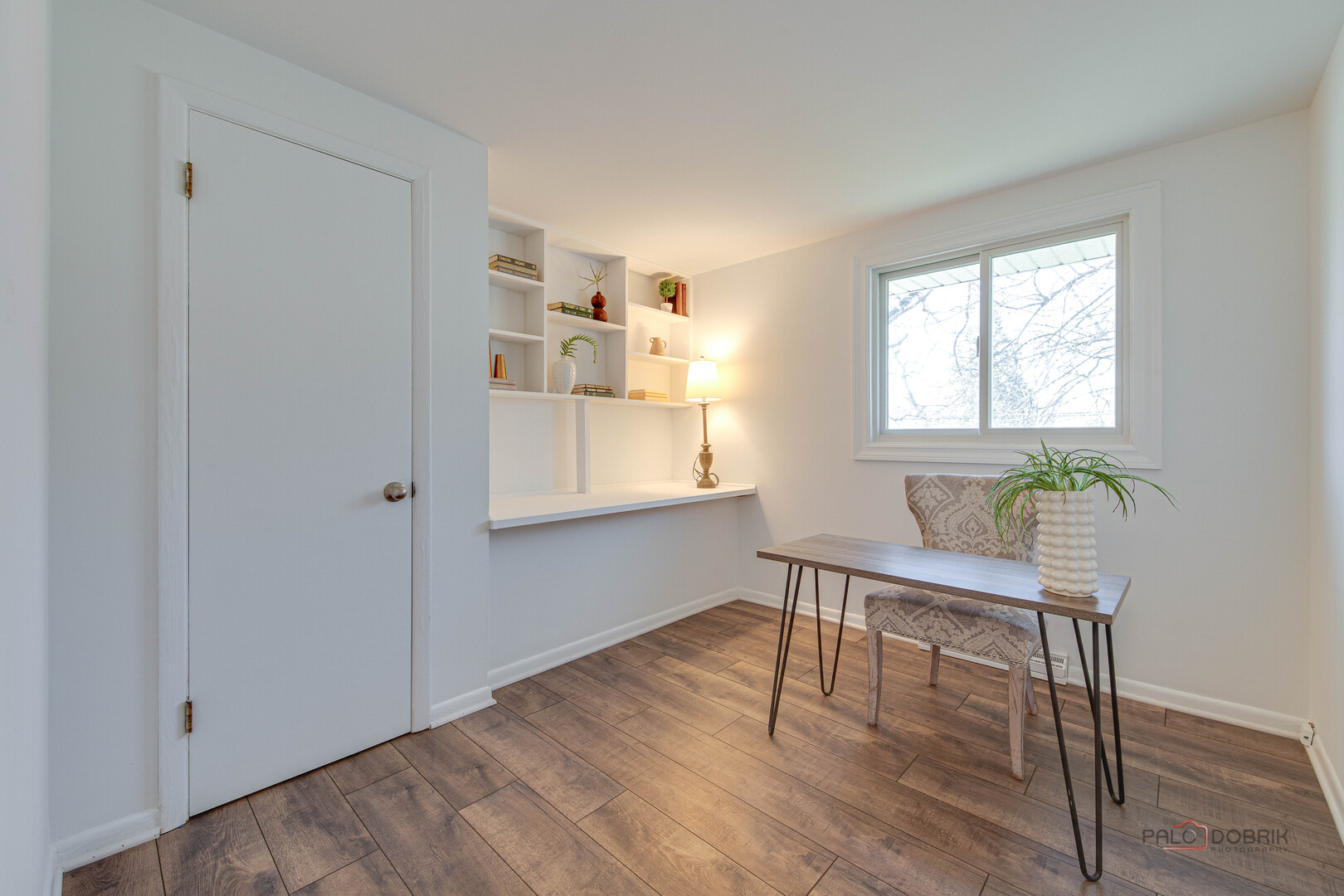 73 South Beck Road Lindenhurst, IL 60046 - Photo 12 of 23 a workspace with wooden floor and a window