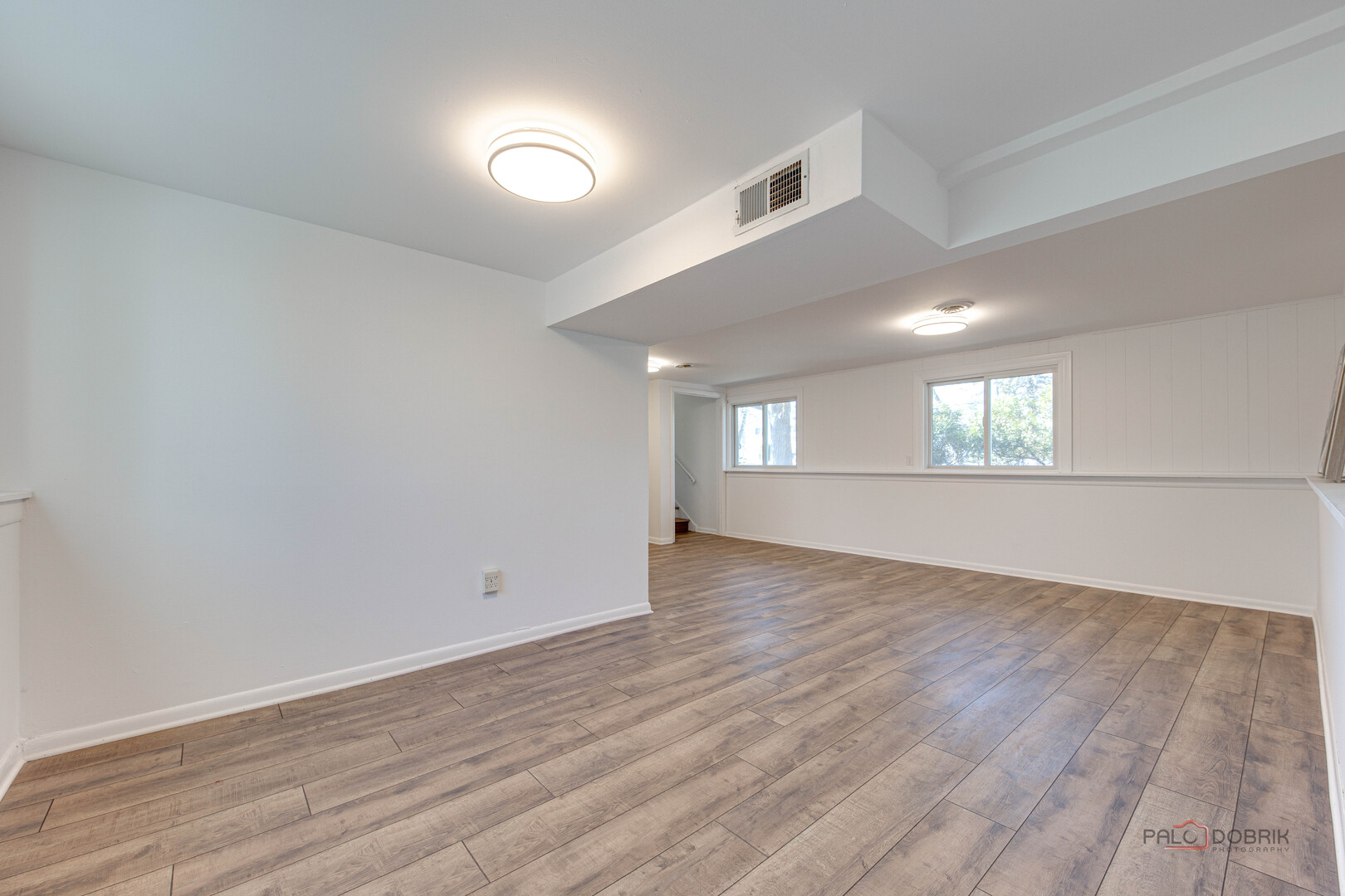 73 South Beck Road Lindenhurst, IL 60046 - Photo 17 of 23 wooden floor in an empty room with a window