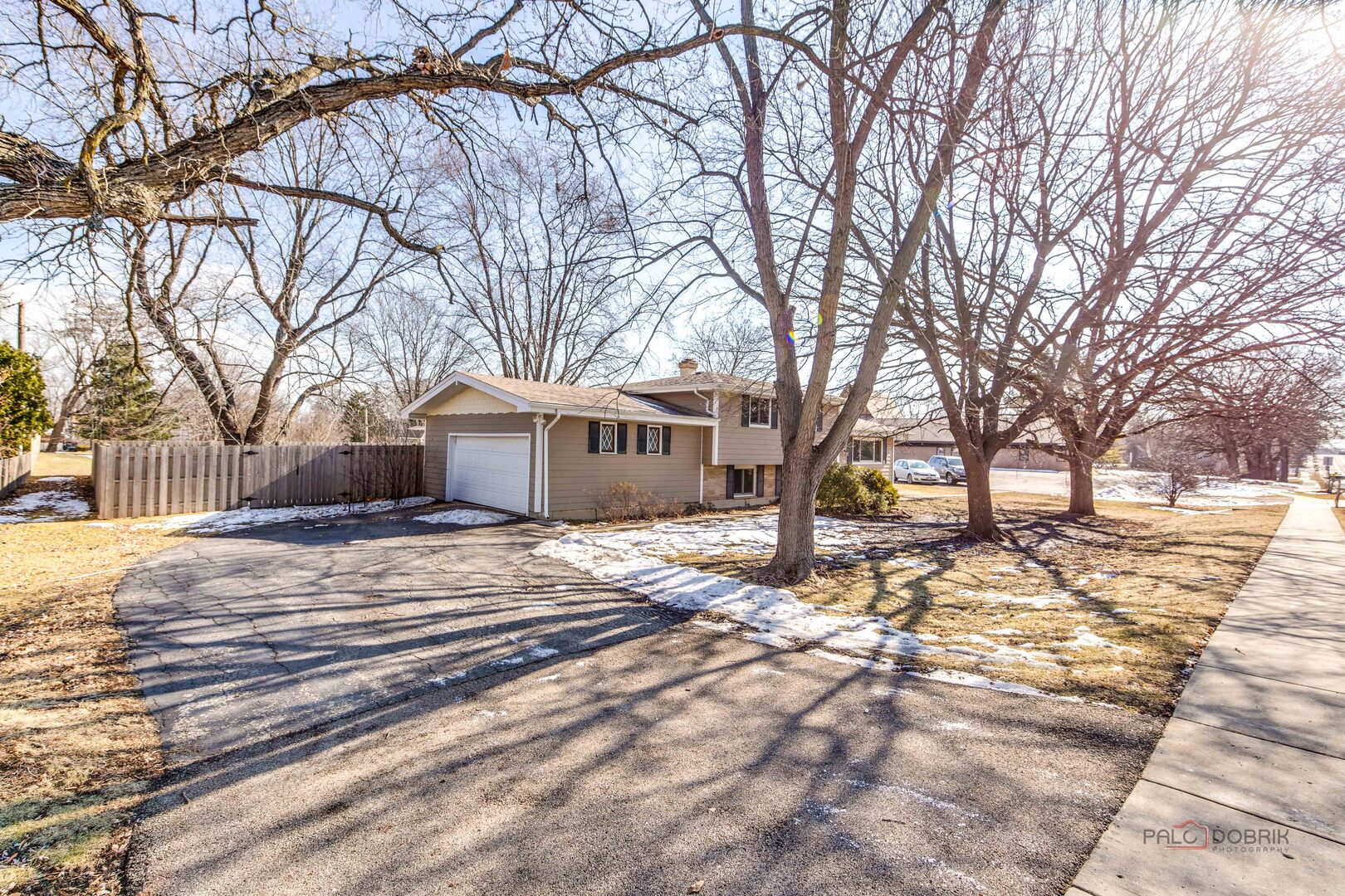 73 South Beck Road Lindenhurst, IL 60046 - Photo 2 of 23 a view of a house with a yard covered in snow
