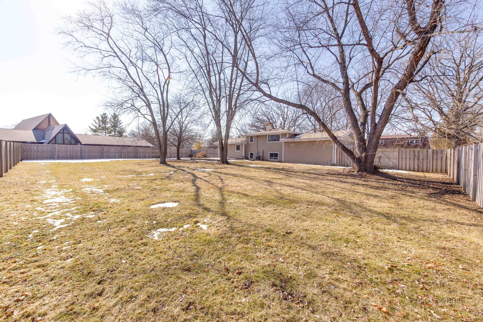 73 South Beck Road Lindenhurst, IL 60046 - Photo 23 of 23 a view of yard covered with snow in front of house