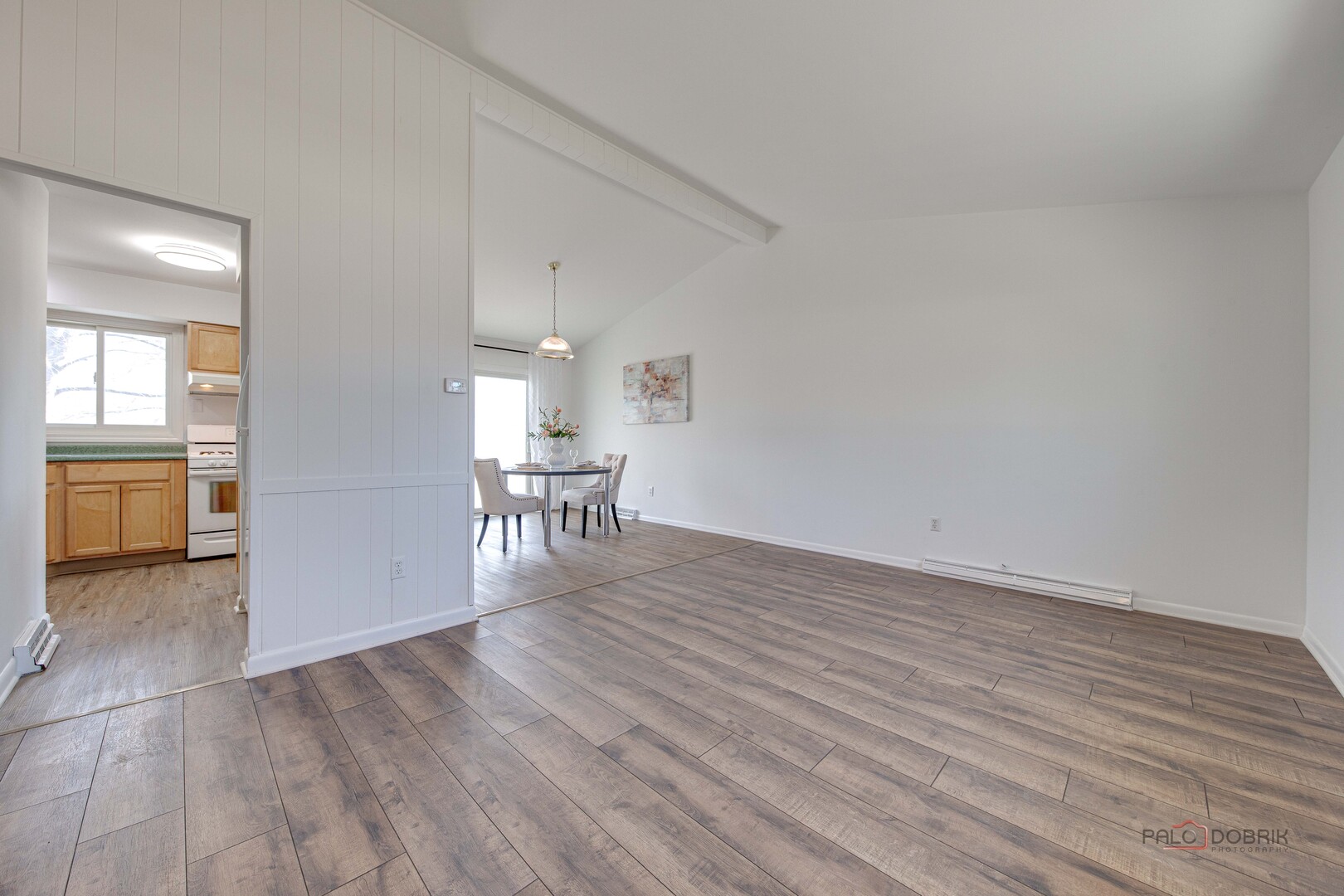 73 South Beck Road Lindenhurst, IL 60046 - Photo 3 of 23 wooden floor in an empty room with a window