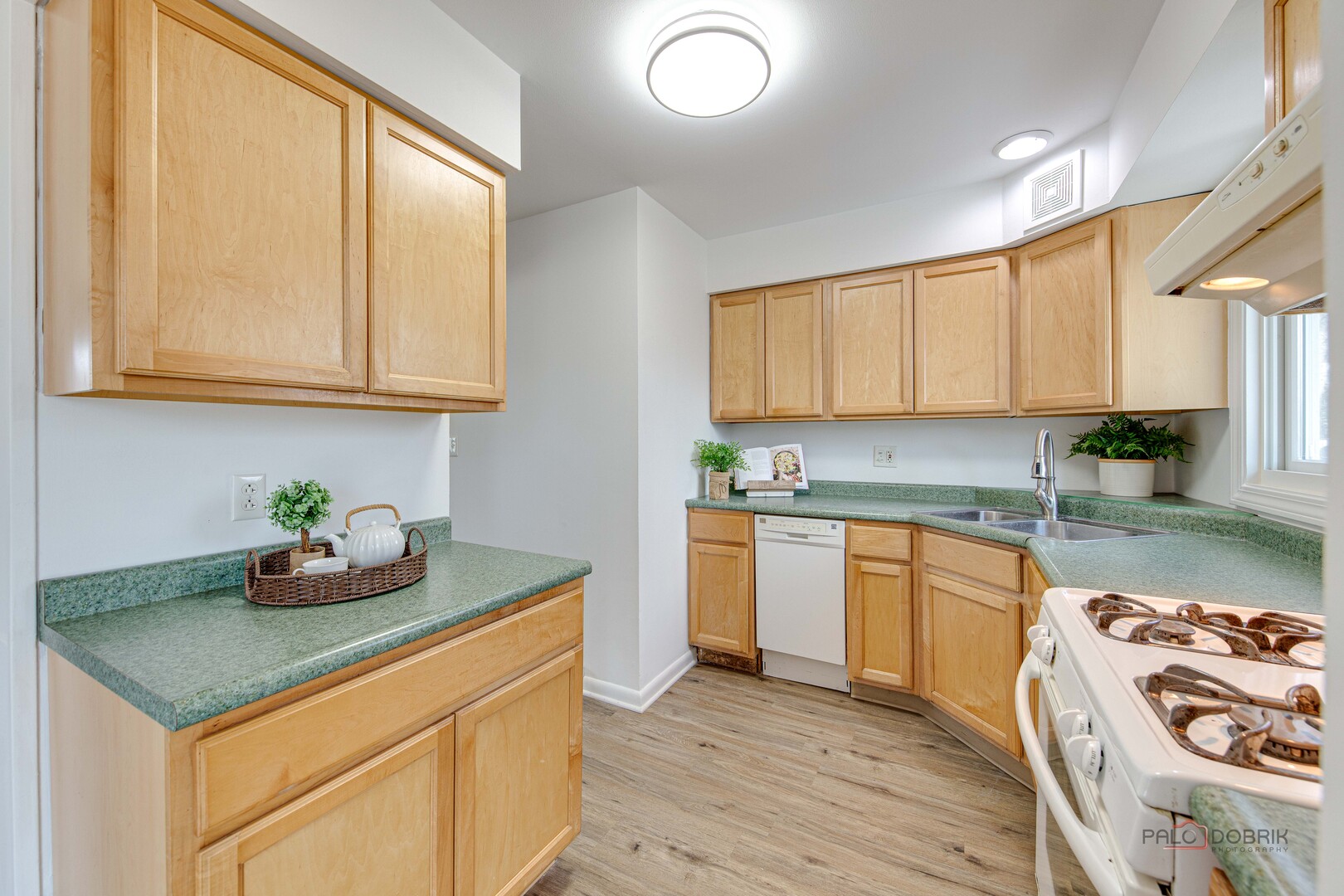 73 South Beck Road Lindenhurst, IL 60046 - Photo 8 of 23 a kitchen with granite countertop a sink a stove and cabinets