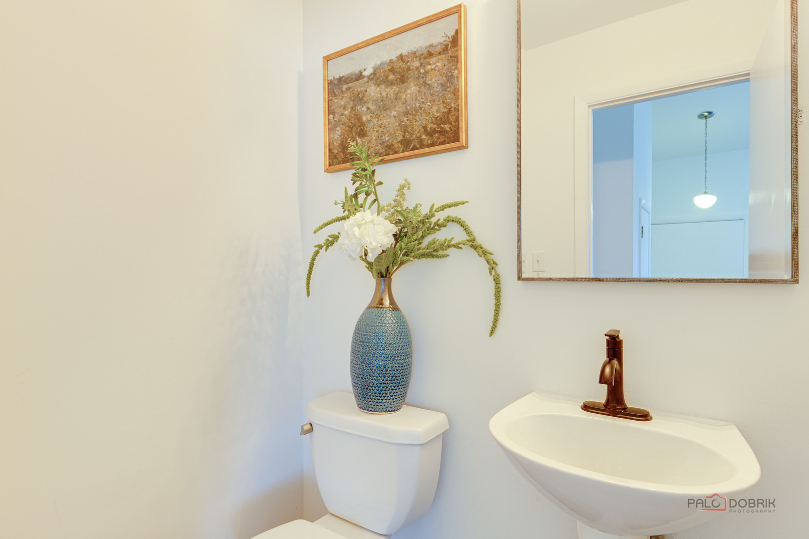 73 South Beck Road Lindenhurst, IL 60046 - Photo 10 of 23 a bathroom with a toilet a sink and mirror