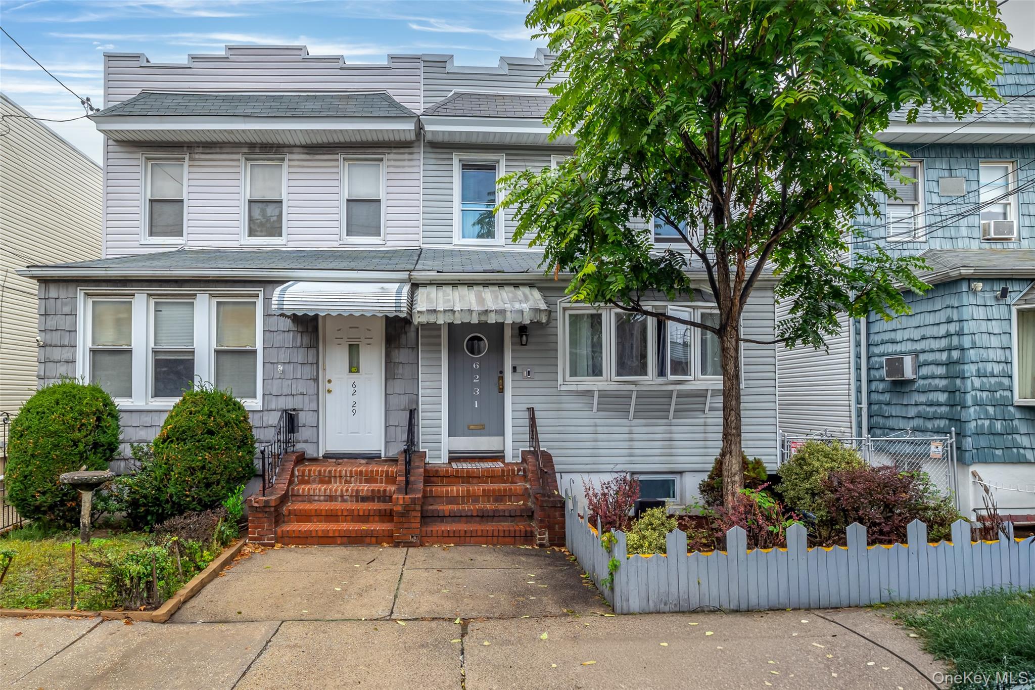 62-31 60th Road Queens, NY 11378 - Photo 1 of 1 front view of a house