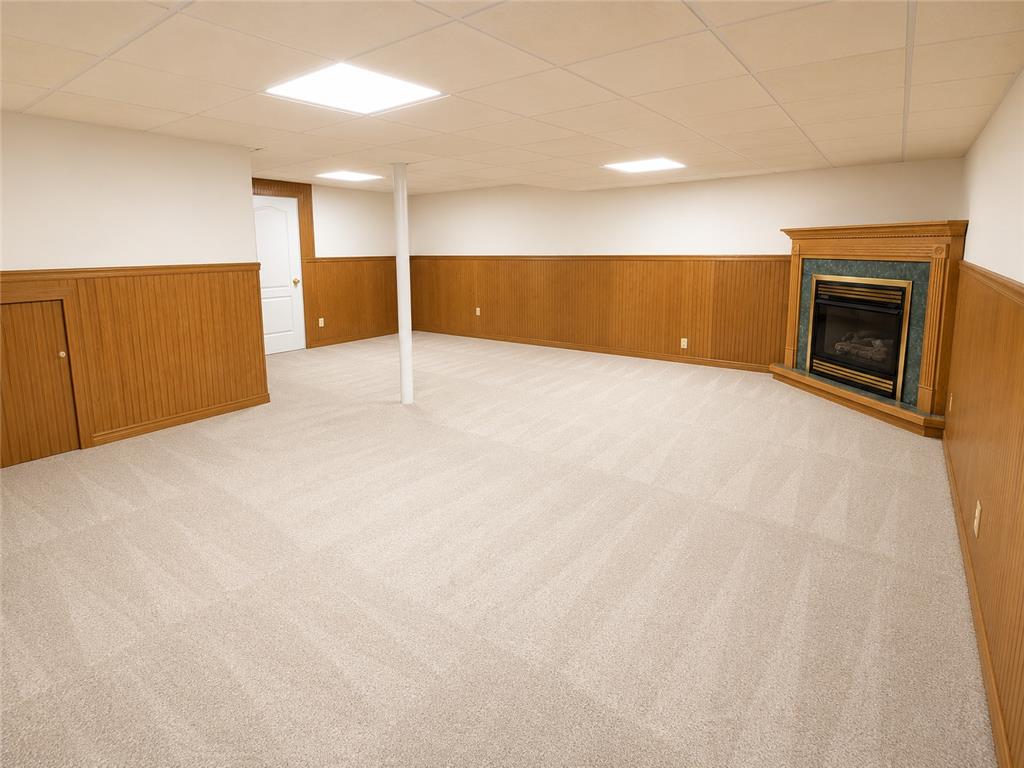 511 Howertown Road Northampton, PA 18067 - Photo 25 of 34 A spacious lower-level area features warm wood wainscoting and a corner fireplace for cozy gatherings.