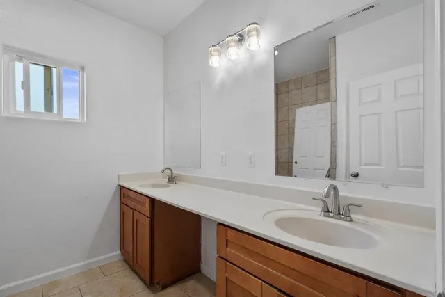 a view of a house with a yard and balcony