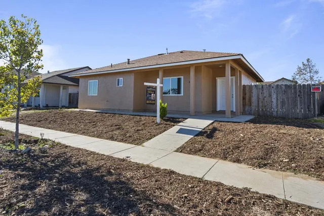 an aerial view of a house with a ocean view